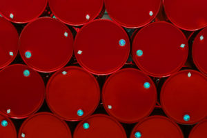 red steel chemical tanks or oil tanks stacked in a row. background and texture