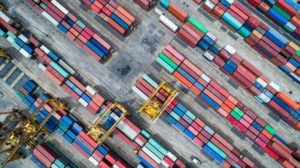 Container ship in import export and business logistics, By crane, Trade Port, Shipping cargo to harbor, Aerial view from drone, International transportation, Business logistics concept