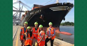UWL Employees pose in front of the container vessel MSC Lucy at the Port of Savannah. From left to right: Johnny Maiden, Latesha Mosley, Dave Pycraft, Adrienne Parrish, Tino Nieves.